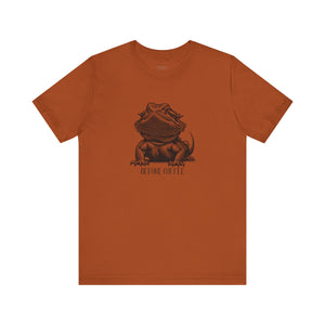 Before Coffee Bearded Dragon Orange t-shirt with a graphic of a bearded dragon and text on a white background