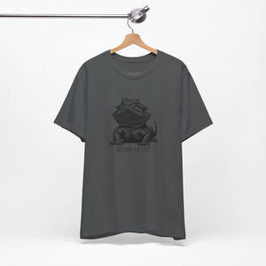 Before Coffee Bearded Dragon Gray t-shirt with a graphic design on a hanger against a white background