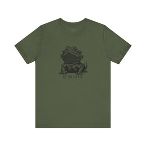 Before Coffee Bearded Dragon Green t-shirt with a bearded dragon graphic and text on a white background