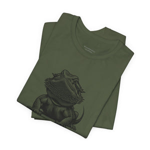 Before Coffee Folded military green t-shirt with a bearded dragon graphic on a white background