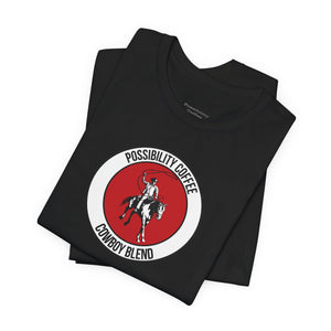 Cowboy Coffee Black t-shirt with a red and white logo featuring a cowboy on a horse, on a white background.