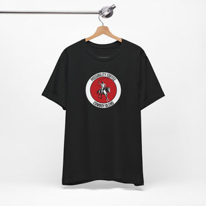 Cowboy Coffee Black t-shirt with a red and white logo on a hanger against a white background