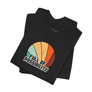 Black t-shirt with colorful design and 'Full of Possibility' text on a white background