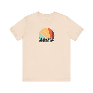 Beige t-shirt with 'Full of Possibility' graphic on a white background