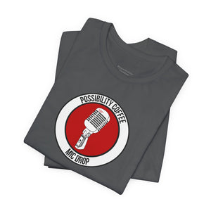 Mic Drop Stack of gray t-shirts with a red and white graphic design on a white background