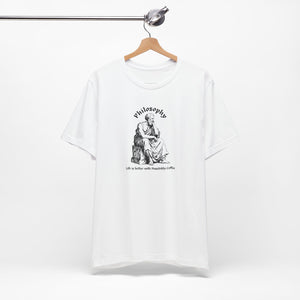 White t-shirt with design on a hanger against a white background