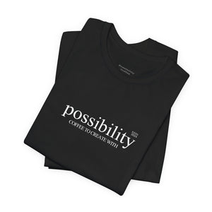 Black t-shirt with 'possibility coffee to create with' text on a white background