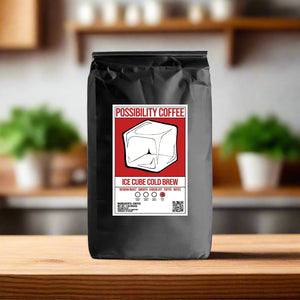 A bag of Possibility Iced Cube Cold Brew Coffee Beans on a wood table in a kitchen