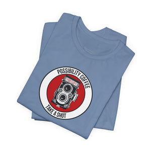 Folded blue t-shirt with a graphic design on a white background