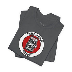 Folded gray t-shirt with a red and white graphic design on a white background