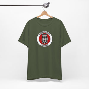 Green t-shirt with a camera graphic and text on a hanger against a white background