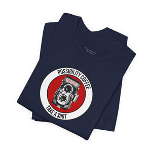 Navy blue t-shirt with a graphic design featuring a camera and text on a white background