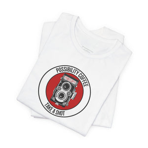 White t-shirt with a red and black graphic design on a white background