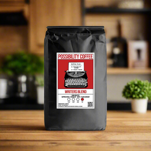 A bag of Possibility Writers Blend Coffee on a wood counter in kitchen