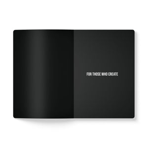 Image of inside of black notebook in a journal style with white background