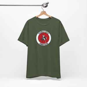 Cowboy Coffee Green t-shirt with a red and white logo on a hanger against a white background