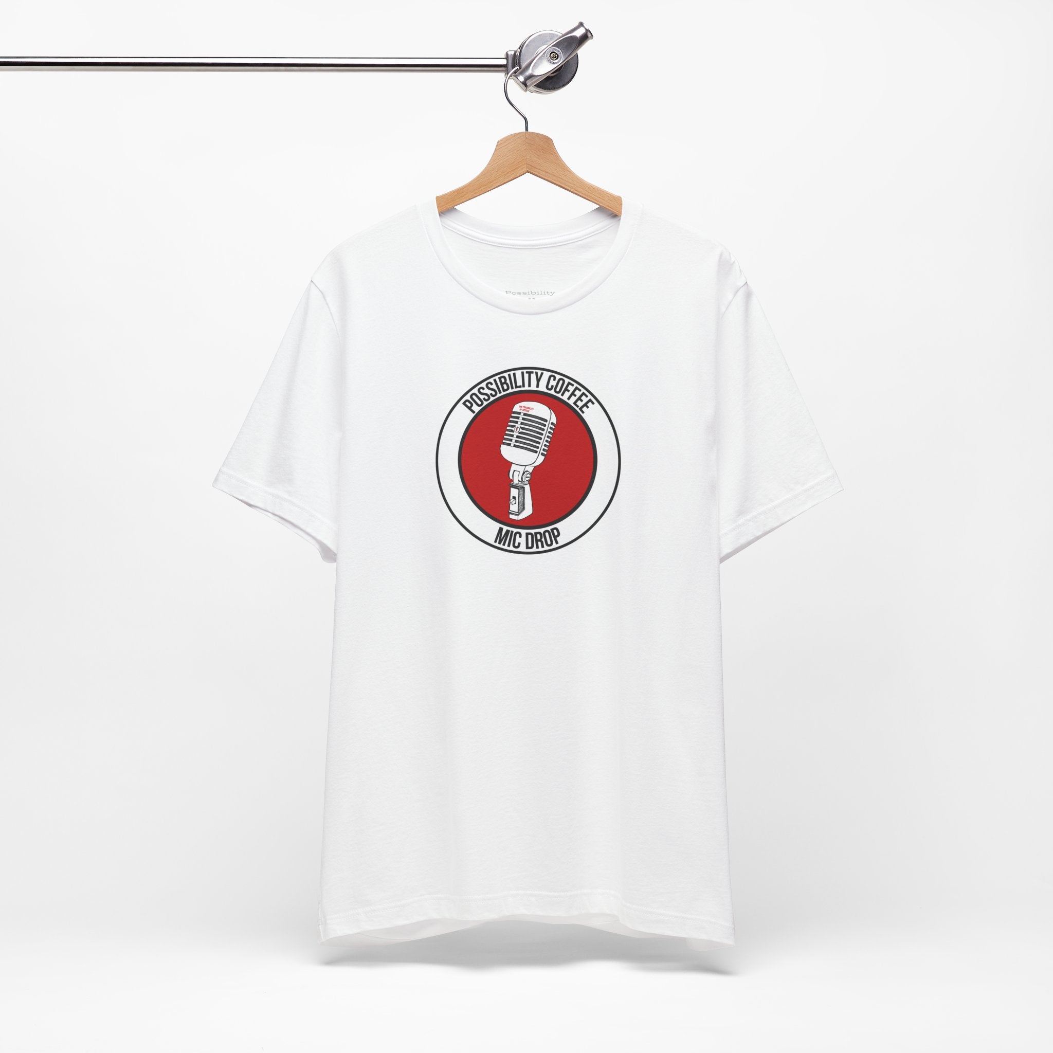 Mic Drop White t-shirt with a red and black graphic on a hanger against a white background