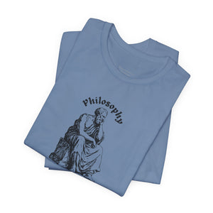 Folded blue t-shirt with design on a white background