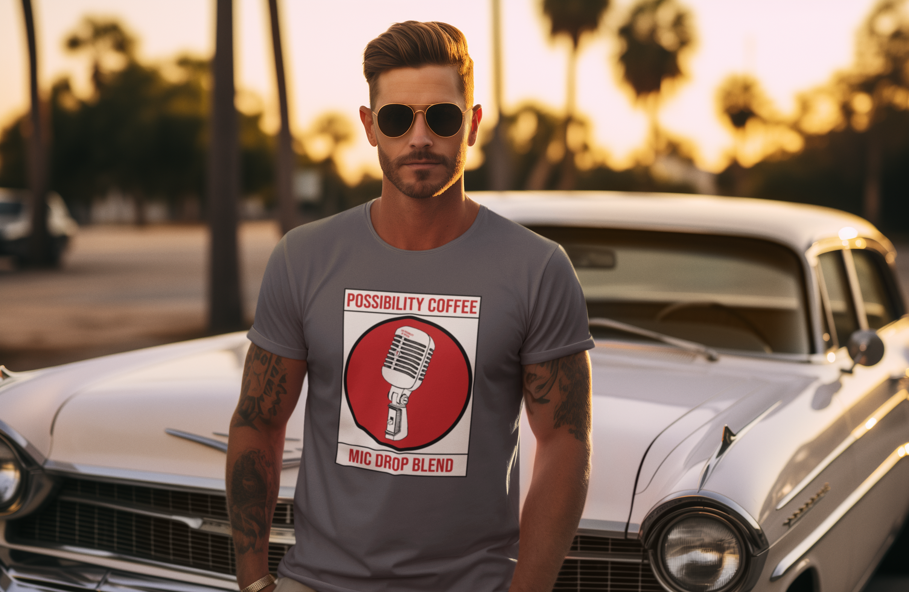 Man wearing Possibility Coffee Mic Drop Blend T-Shirt in front of classic car 