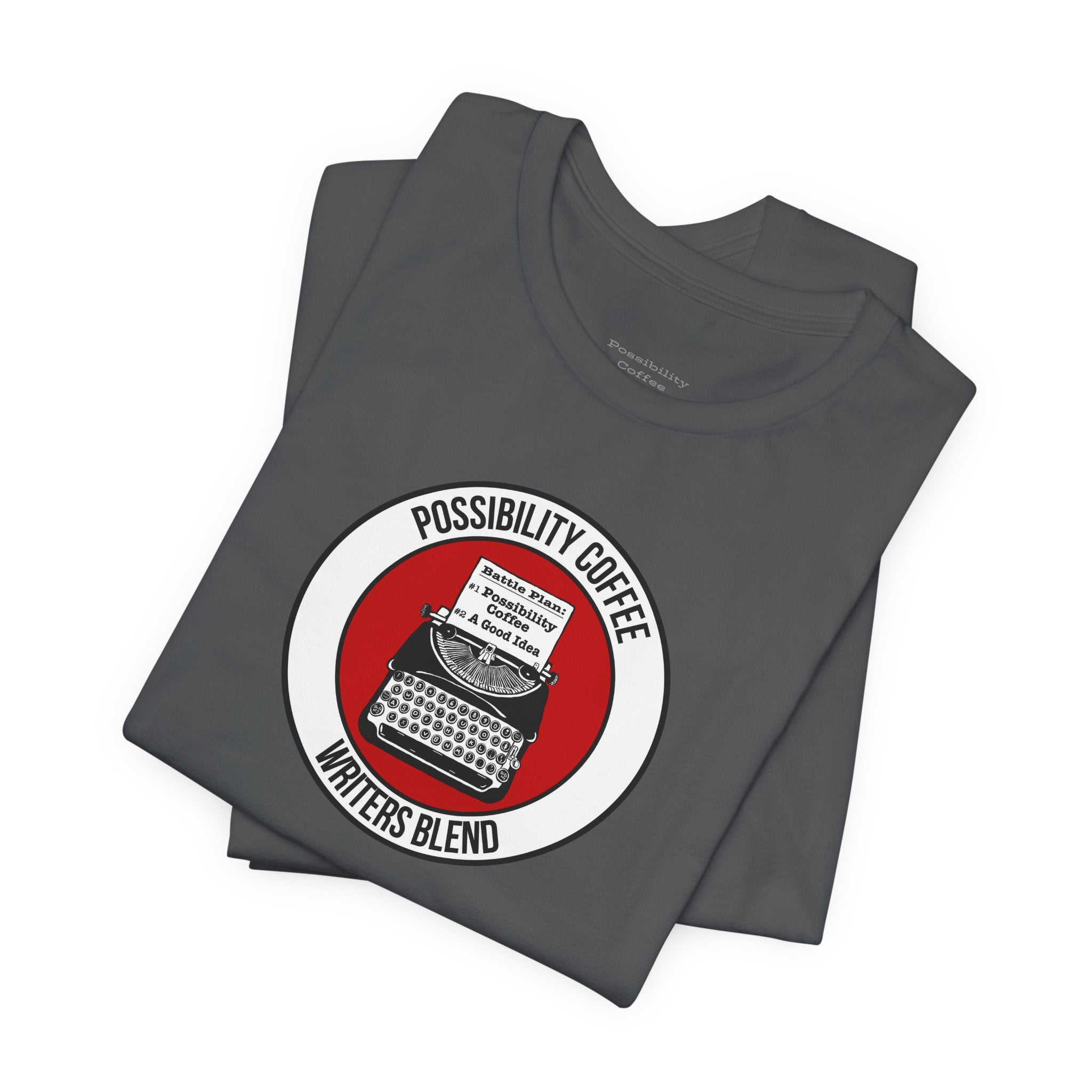Writers Blend Typewriter Stack of gray t-shirts with a 'Possibility Coffee' graphic on a white background