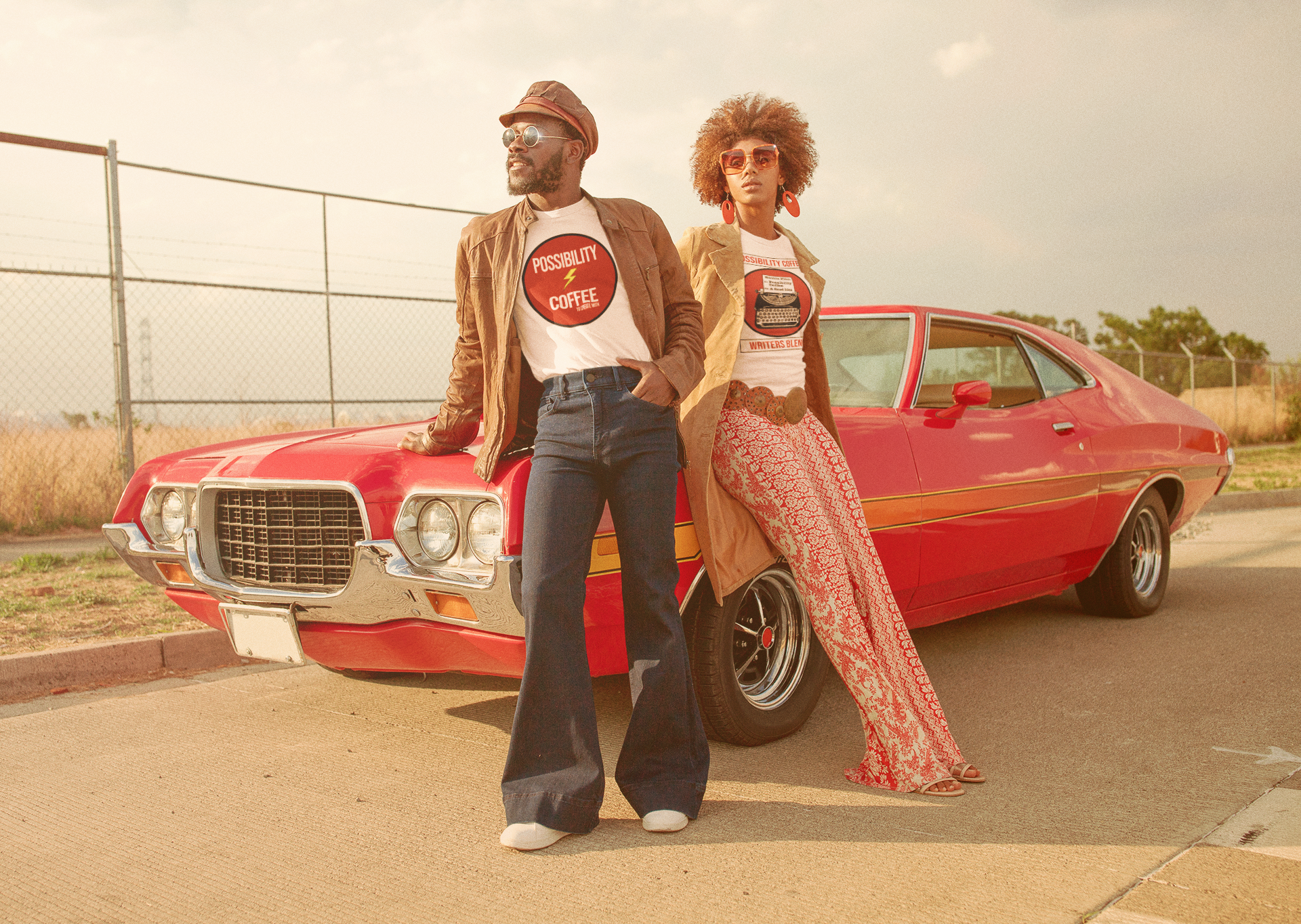 Man and woman wearing Possibility Coffee Logo T-Shirt